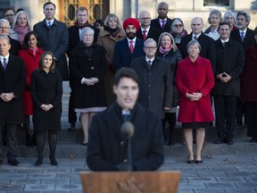 Members of cabinet stand behind Prime Minister Justin Trudeau as he speaks to reporters following a swearing in ceremony at Rideau Hall in Ottawa, on Wednesday, Nov. 20, 2019.
