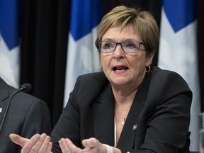 Quebec's Auditor General Guylaine Leclerc tables a reports, Wednesday, November 20, 2019 at the legislature in Quebec City. Quebec's auditor general says there's numerous shortcomings in the management of cases reported to the province's youth protection agency.