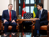 Saskatchewan Premier Scott Moe speaks, Prime Minister Justin Trudeau listens during a meeting on Nov. 12, 2019.