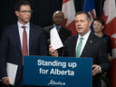 Premier Jason Kenney and Justice Minister Doug Schweitzer speak at the Alberta Legislature in Edmonton, June 26, 2019.