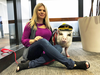 LiLou the therapy pig and her owner Tatyana Danilova at San Francisco International Airport.