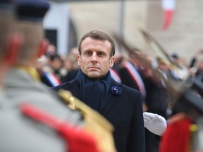 French President Emmanuel Macron reviews the troops during a visit to the First World War Battle of the Marne Memorial in Dormans, France, on Nov. 15, 2019.