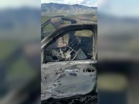 The burnt wreckage of a vehicle is seen after a family was attacked by unknown gunmen in Bavispe, Sonora, Mexico Nov. 4, 2019.