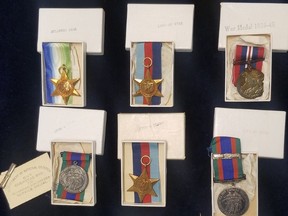 War medals donated to a Goodwill store in Calgary are shown in a handout photo from the Goodwill Alberta Twitter page. The store is looking to track down relatives of a Second World War soldier whose medals were donated.