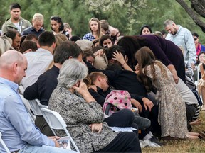 Relatives and friends mourn during the funeral service of Dawna Ray Langford, 43, and her sons Trevor and Rogan, who were among nine victims killed on Monday in a hail of bullets in an attack authorities have blamed on a drug cartel, at La Mora Ranch in the municipality of Bavispe, Sonora State, Mexico, on November 7, 2019.