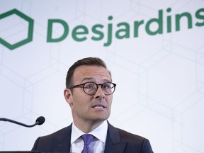 Desjardins President and CEO Guy Cormier reads a statement during a news conference in Montreal on June 20, 2019. The Desjardins Group data theft is much larger than first thought, affecting 4.2 million members -- up from the 2.9 million first reported in June.THE CANADIAN PRESS/Paul Chiasson