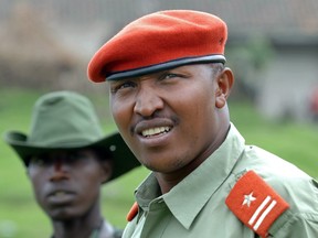 A picture taken on January 11, 2009 shows rebel General Bosco Ntaganda, self-declared leader of the National Committee for the Defense of the People (CNDP), escorted by comrades at his mountain base in Kabati, 40 kilometres north-west of the provincial capital Goma.
