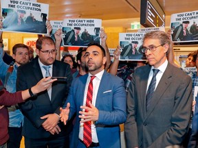 American citizen Omar Shakir (C), the director of the New York-based Human Rights Watch for Israel and the Palestinian territories, delivers a speech at Ben Gurion airport on November 25, 2019, after being expelled from Israel.