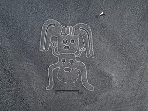 Using AI technology, researches found a geoglyph of a “humanoid figure standing on two feet”. Credit: Yamagata University/IBM Japan