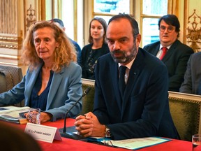 French Prime Minister Edouard Philippe leads a meeting focused on immigration policies, next to French Justice Minister Nicole Belloubet, at the Hotel Matignon in Paris, France November 6, 2019.