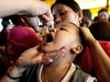 A child receives free polio vaccine during a government-led mass vaccination program in Quezon City, Metro Manila, Philippines, Oct. 14, 2019.