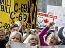 Pro-pipeline supporters rally against Bill C-69, in Calgary on March 25, 2019.