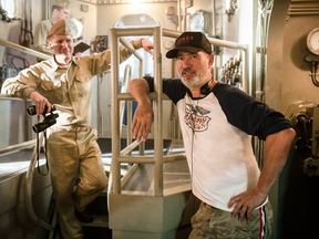 Director Roland Emmerich, right, behind the scenes in Midway.