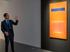 An art expert from Sotheby’s talks about Mark Rothko’s “Blue Over Red” during an auction preview Nov. 1, 2019 at Sotheby’s in New York.