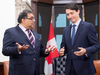 Prime Minister Justin Trudeau speaks with Calgary mayor Naheed Nenshi on Parliament Hill in Ottawa on Nov. 21, 2019.