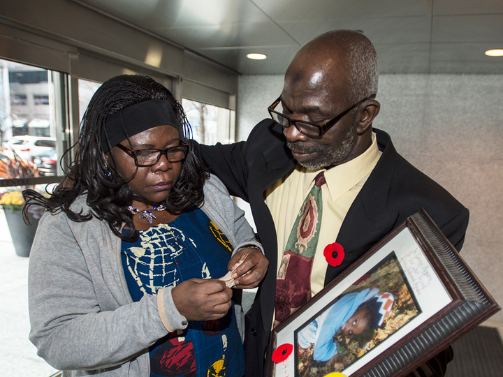  May Hyacenth Abudu and Abudu Ibn Adam hold a photo of their five-year-old daughter Amina, who died days after receiving the pandemic-flu vaccine in 2009. Peter J. Thompson/National Post