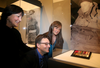 The three grandchildren of Lt. Col. Currie, from left, David, Brenda and Sandy Currie, look at his medal collection after their unveiling at the Canadian War Museum, May 1, 2018.