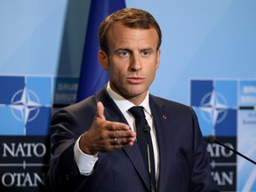 French President Emmanuel Macron addresses a press conference on the second day of the North Atlantic Treaty Organization (NATO) summit in Brussels, Belgium, July 12, 2018.