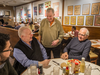 Yitz’s Deli owner Barry Silver, standing, chats with longtime customers Elliot Cohen, left, and Marty Sversky at his soon-to-be-closed location at Eglinton and Avenue Road.