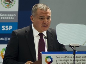 In this file photo taken on March 9, 2012 former Mexican Secretary of Public Safety Genaro Garcia Luna speaks during the inauguration of the Federal Police's scientific division in Mexico City.