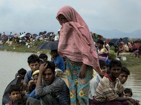 Displaced Rohingya refugees from Rakhine state in Myanmar rest near Ukhia, near the border between Bangladesh and Myanmar, as they flee violence on September 4, 2017.