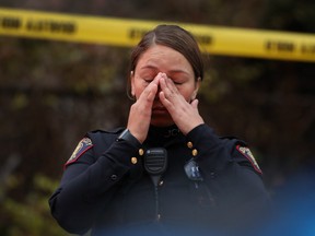 A Jersey City police officer reacts at the scene of a shooting that left multiple people dead on December 10, 2019 in Jersey City, New Jersey.