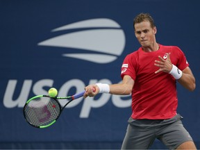 Vasek Pospisil of Canada returns a shot against Tennys Sandgren of the United States in a second round match on day four of the 2019 U.S. Open tennis tournament at USTA Billie Jean King National Tennis Center.