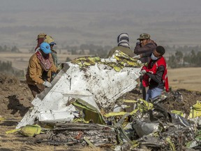 In this March 11, 2019, file photo, rescuers work at the scene of an Ethiopian Airlines flight crash outside of Addis Ababa, Ethiopia.