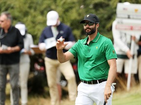 Adam Hadwin of Canada reacts to his birdie to go 1 up on the first green during Friday foursome matches on Day Two of the 2019 Presidents Cup at Royal Melbourne Golf Course on Dec. 13, 2019, in Melbourne, Australia.