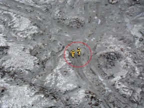 This handout aerial photo taken and released on December 13, 2019 by the New Zealand Defence Force shows elite soldiers taking part in a mission to retrieve bodies from White Island after the December 9 volcanic eruption, off the coast from Whakatane on the North Island.