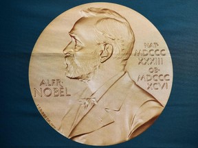 In this file photo taken on October 01, 2018 A portrait of Swedish inventor and scholar Alfred Nobel can be seen on a banner on display at the Nobel Forum in Stockholm, Sweden, prior to a press conference to announce the winner of the 2018 Nobel Prize in Physiology or Medicine at the Karolinska Institute in Stockholm, Sweden.