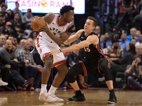 Toronto Raptors forward OG Anunoby controls the ball as Miami Heat forward Duncan Robinson defends in the first half at Scotiabank Arena.