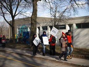 Educators picket outside the Bickford Centre in Toronto on Wednesday Dec. 11, 2019. High school teachers at nine Ontario school boards are conducting their second job action in as many weeks, as the province's education minister urges them to return to the bargaining table.