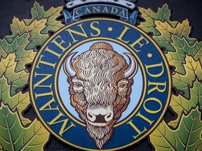 The RCMP logo is seen outside Royal Canadian Mounted Police "E" Division Headquarters, in Surrey, B.C., on Friday April 13, 2018. Police just east of Jasper National Park have issued an Amber Alert for a 14-month-old child believed to have been abducted by his father.