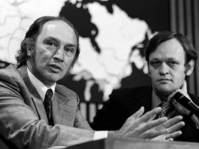 Prime Minister Pierre Trudeau speaks at a press conference in Ottawa on June 19, 1972. Beside him is Cabinet Minister Jean Chretien.