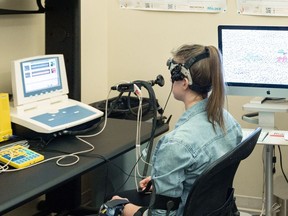 A research trainee is seen during a demonstration of the measurement of blood flow to the brain through transcranial doppler ultrasound at the University of British Columbia's Okanagan campus, in Kelowna, B.C., in an undated handout photo. The ultrasound is one way UBC scientists are looking for evidence of traumatic brain injury in survivors of intimate partner violence.