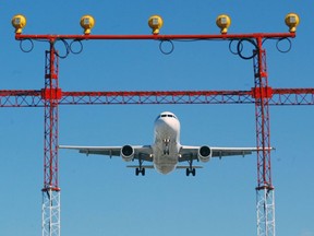 An Air Canada jet prepares to land at Pearson International Airport in Toronto on September 30, 2004.