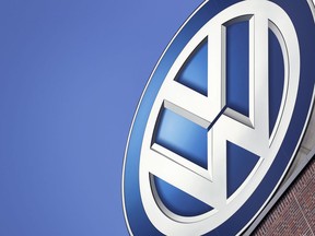 In this Wednesday, Aug. 1, 2018, file photo a logo of the car manufacturer Volkswagen is pictured on top of a company building in Wolfsburg, Germany. The federal government today charged Volkswagen for importing cars into Canada company executives knew violated emissions standards.