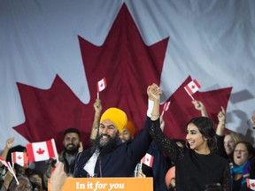 NDP leader Jagmeet Singh and his wife Gurkiran Kaur Sidhu reacts on stage to supporters at his election night headquarters in Burnaby, B.C., on Tuesday, October 22, 2019. An analysis of how ethnic media covered the federal election suggests it quite closely mirrored that of the mainstream press.