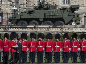The federal government is predicting Canadian defence spending as a share of GDP will increase more over the next five years than originally planned -- though not because of any major new injections of funds into the military. Chief of Defence Staff Jonathan Vance inspects the troops during a change of command parade on Parliament Hill Tuesday, August 20, 2019 in Ottawa.