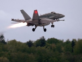 An RCAF CF-18 takes off from CFB Bagotville, Que. on Thursday, June 7, 2018. Canada's air force is turning to contractors as it seeks to manage a shortage of experienced military pilots and aircraft technicians.
