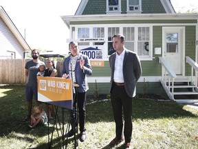 Adrien Sala, NDP candidate for St James, right, listens as Wab Kinew, leader of the Manitoba NDP, centre, speaks during a press conference in Winnipeg Friday, August 16, 2019, as Ben and Carly Cressman, and their daughters Hannah, 2, and Stella, 3, look on. Manitoba could become the next battleground over time change. The Opposition New Democrats are launching a website and public consultations on whether the province should stop springing forward to daylight time in March and falling back to standard time in November and, if so, what time should be adopted. "There are lots of problems associated with time change that have been studied -- things like negative sleep impacts. There's significant changes in terms of people's health," said New Democrat legislature member Adrien Sala.