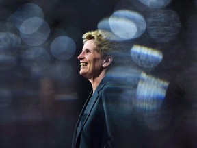 Ontario Liberal Leader Kathleen Wynne is pictured between glasses as she speaks during a campaign stop at Crosscut Distillery in Sudbury, Ont., on Wednesday, May 23, 2018. The official portrait of Ontario's first female premier is set to be unveiled at the legislature later today.