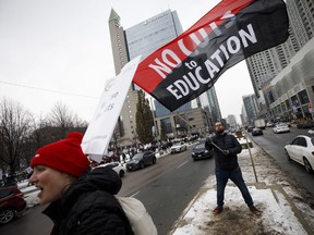 Striking teachers of the Ontario Secondary School Teachers Federation picket outside of the Toronto District School Board head office on Yonge St. in Toronto, Wednesday, Dec. 4, 2019.