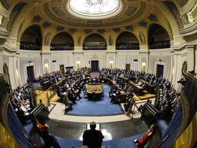 The Manitoba legislature started its winter break Thursday with bills governing everything from Sunday shopping to public cannabis consumption still not passed into law. Chief Justice Richard Chartier, administrator of the Province of Manitoba, reads the Speech from the Throne at the Manitoba Legislature in Winnipeg, Monday, Nov. 19, 2019.