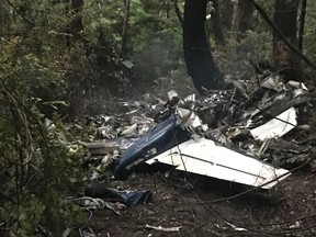 The scene of a small plane crash on Gabriola Island, B.C., is shown on Wednesday, Dec.11, 2019. A plane that one witness describes as crashing in a "huge explosion" that left multiple people dead in British Columbia has been identified as a twin-engine propeller aircraft.