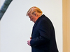 U.S. President Donald Trump exits from the White House as he heads for a campaign rally in Michigan, Dec. 18, 2019.