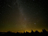 Meteors occur when a piece of debris, such as a small rock, left by a passing comet or asteroid burns up in the Earth’s atmosphere, leaving a fiery streak in its wake.