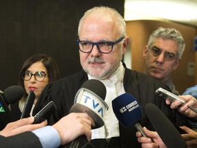 Crown Prosecutor Richard Roy speaks to reporters in Montreal, Wednesday, December 18, 2019, after SNC-Lavalin pleaded guilty in their ongoing fraud case. SNC-Lavalin Group Inc. has settled criminal charges related to work the company did in Libya Wednesday, with its construction division pleading guilty to a single count of fraud and bringing the company a step closer to closing a long-standing scandal that tarnished its reputation and ensnared the highest office of the Canadian government.