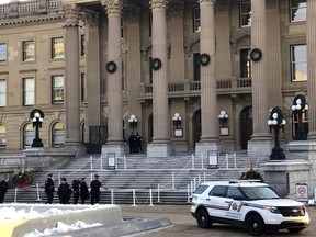 Multiple police officers respond to a body found on the steps of the Legislature Monday afternoon. The event was deemed non-criminal by police. Janet French/Postmedia